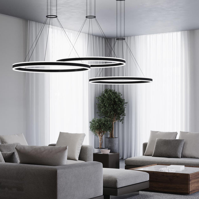 Double Corona™ Ring LED Pendant Light in living room.