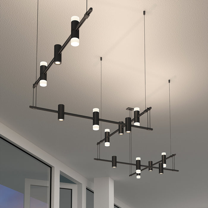Suspenders® Zig Zag LED Pendant Light with Double Ended Cylinders in living room.