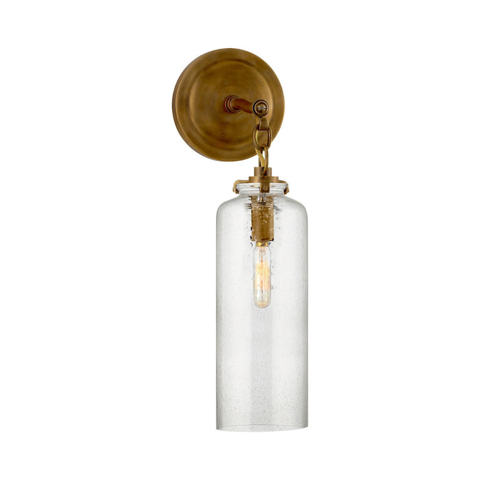Katie Cylinder Wall Light in Hand-Rubbed Antique Brass/Seeded Glass.