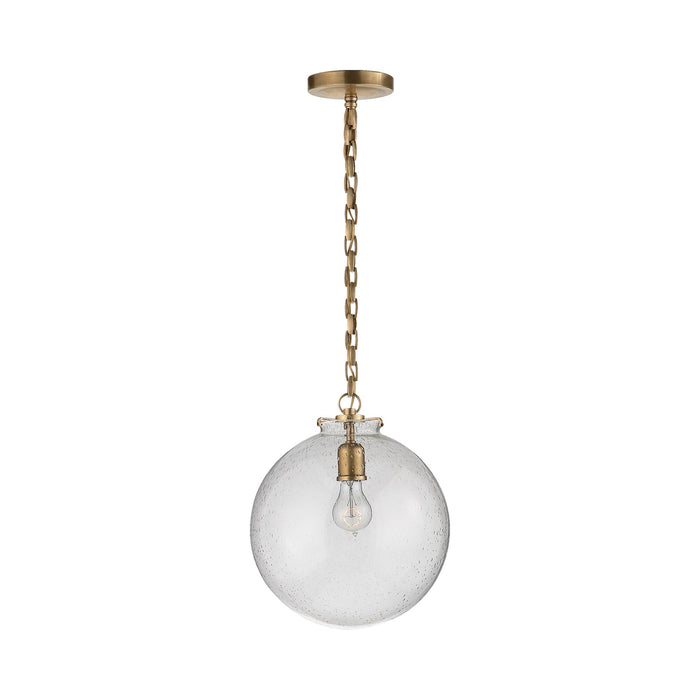 Katie Globe Pendant Light in Hand-Rubbed Antique Brass/Seeded Glass.