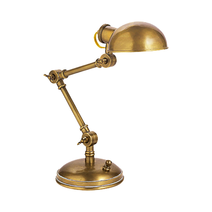 The Pixie Desk Lamp in Hand-Rubbed Antique Brass.